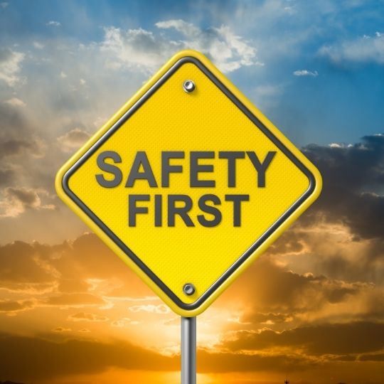 safety first sign on a sunset background
